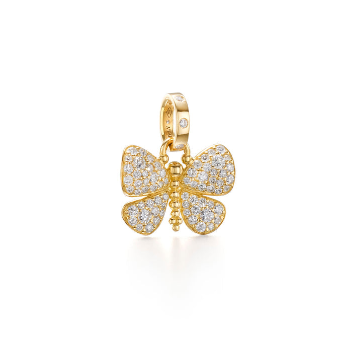An 18K yellow gold pendant in the shape of a butterfly, adorned with diamonds.