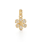 An 18K gold pendant in the shape of a flower covered with diamond embellishments.