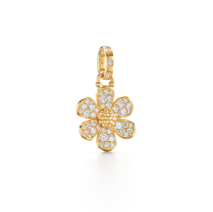 An 18K gold pendant in the shape of a flower covered with diamond embellishments.