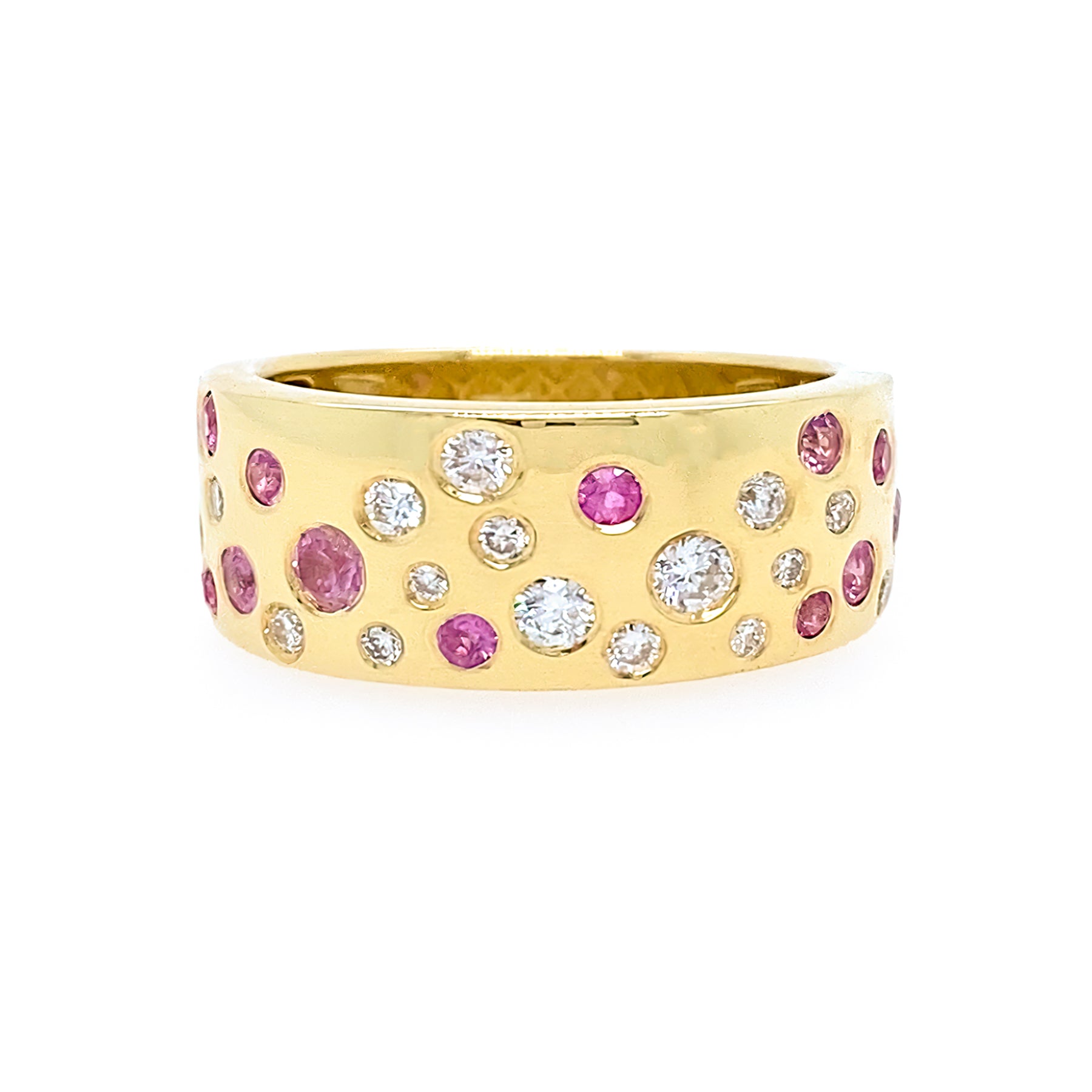 Gold ring with pink and white gemstones on a white background