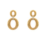 Gold drop earrings with intricate design on a white background