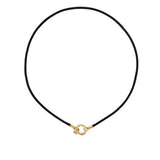 A black leather cord with a gold-colored clasp designed by Temple St Clair