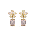 A pair of 18K yellow gold flower-shaped drop earrings adorned with clear pavé diamonds and a large rectangular pale pink amethyst gemstone below, shown on a plain white background.