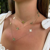 Woman wearing three 14K Yellow Gold Clover Station Necklaces