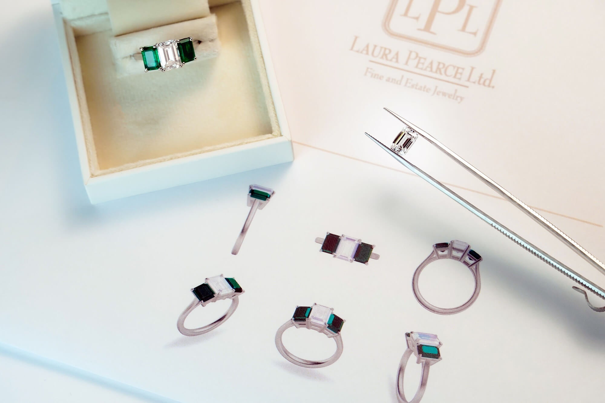 Custom rings featuring emerald gemstones and diamonds