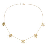 18K yellow gold necklace with floral pendants and diamonds on a white background