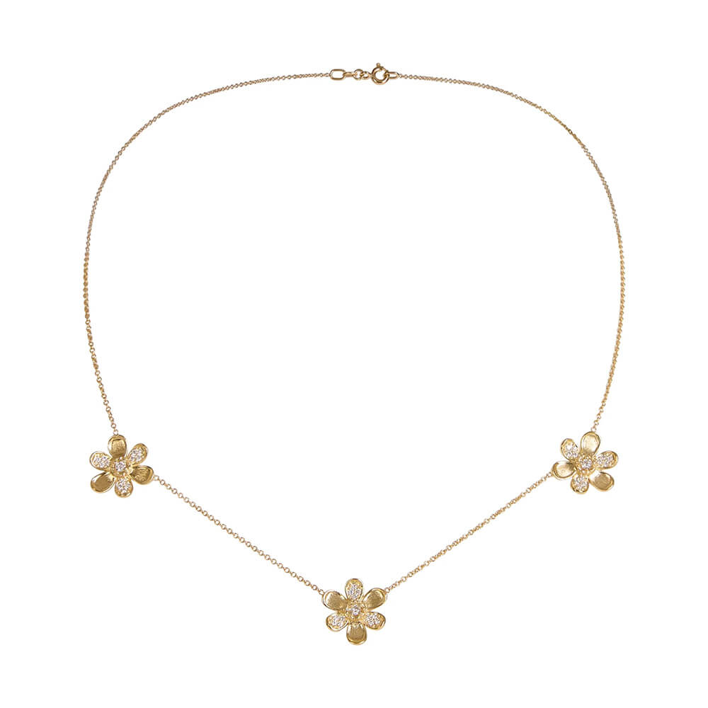 A delicate 18K yellow gold chain necklace featuring three small flower charms, each adorned with clear pavé diamonds, arranged symmetrically on a plain white background.