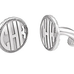 A pair of sterling silver cufflinks with a block monogram design.