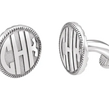 A pair of sterling silver cufflinks with a block monogram design.