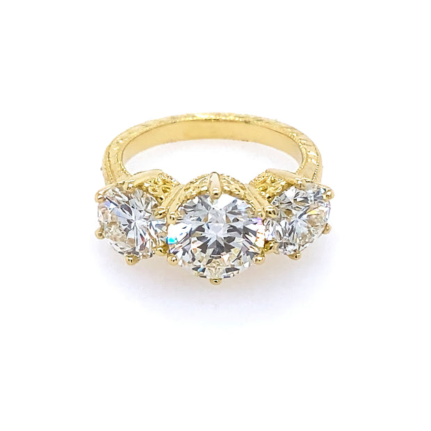 18kt Yellow Gold and Diamond Three Stone Diamond Ring