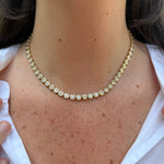 large bezel tennis necklace on neck