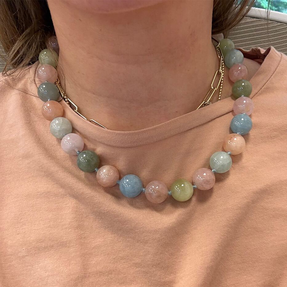 woman wearing multi-colored bead necklace with 14K gold clasp