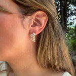 pear_shape_diamond_earrings_on_ear