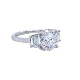 Platinum Round Diamond Ring with Trapezoid Side Stones