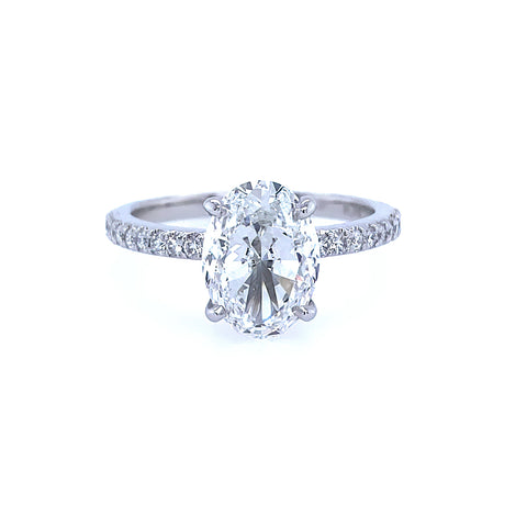 Platinum and oval diamond ring with bands on the band