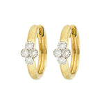 A pair of 18K yellow gold hoop earrings with diamond floral designs by Jude Frances

