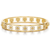 An 18K yellow gold bracelet with flower designs covered in diamonds