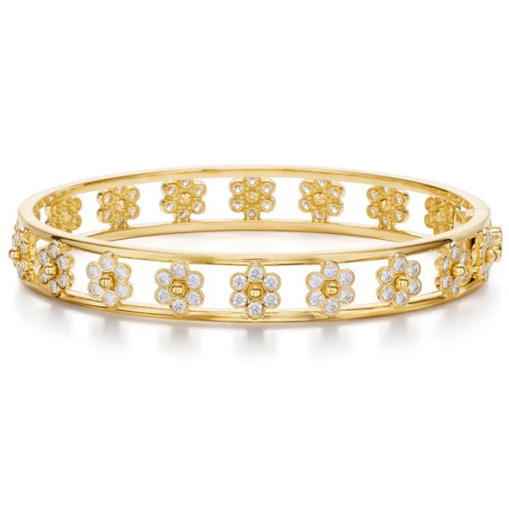 An 18K yellow gold bracelet with flower designs covered in diamonds