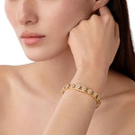 woman wearing Temple St Clair 18K gold Fiori bracelet with diamonds