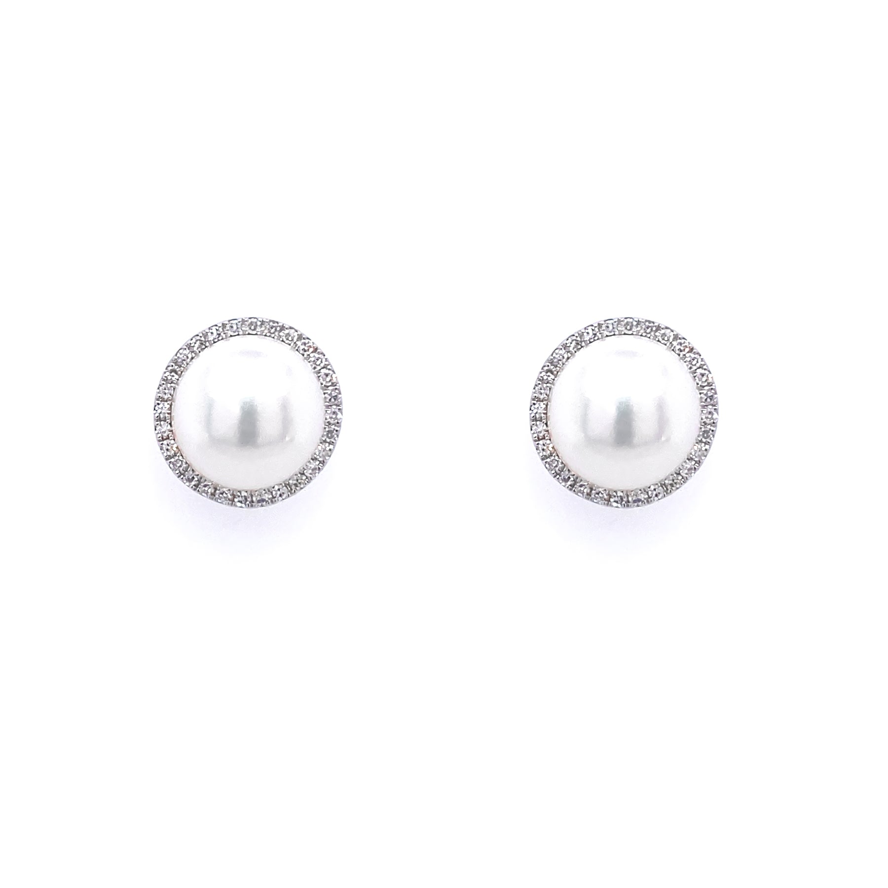 A pair of 14K white gold pearl and diamond earrings with circular designs