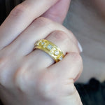 woman wearing 14K gold and diamond ring
