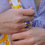 woman wearing tanzanite rings