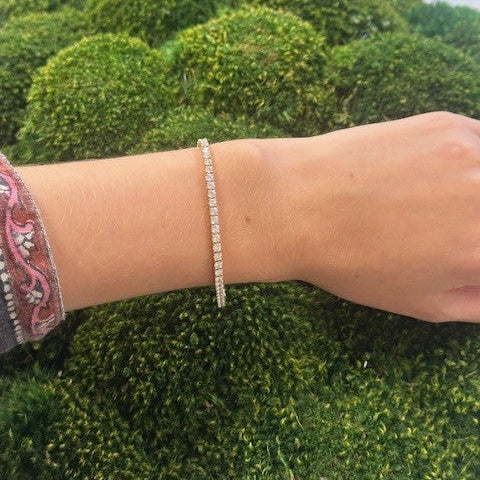 Close-up of a woman wearing a tennis bracelet