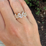 yg_round_and_marquise_diamond_ring_on_hand