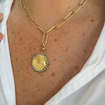 yg_sapphire_bezel_pendant_on_neck