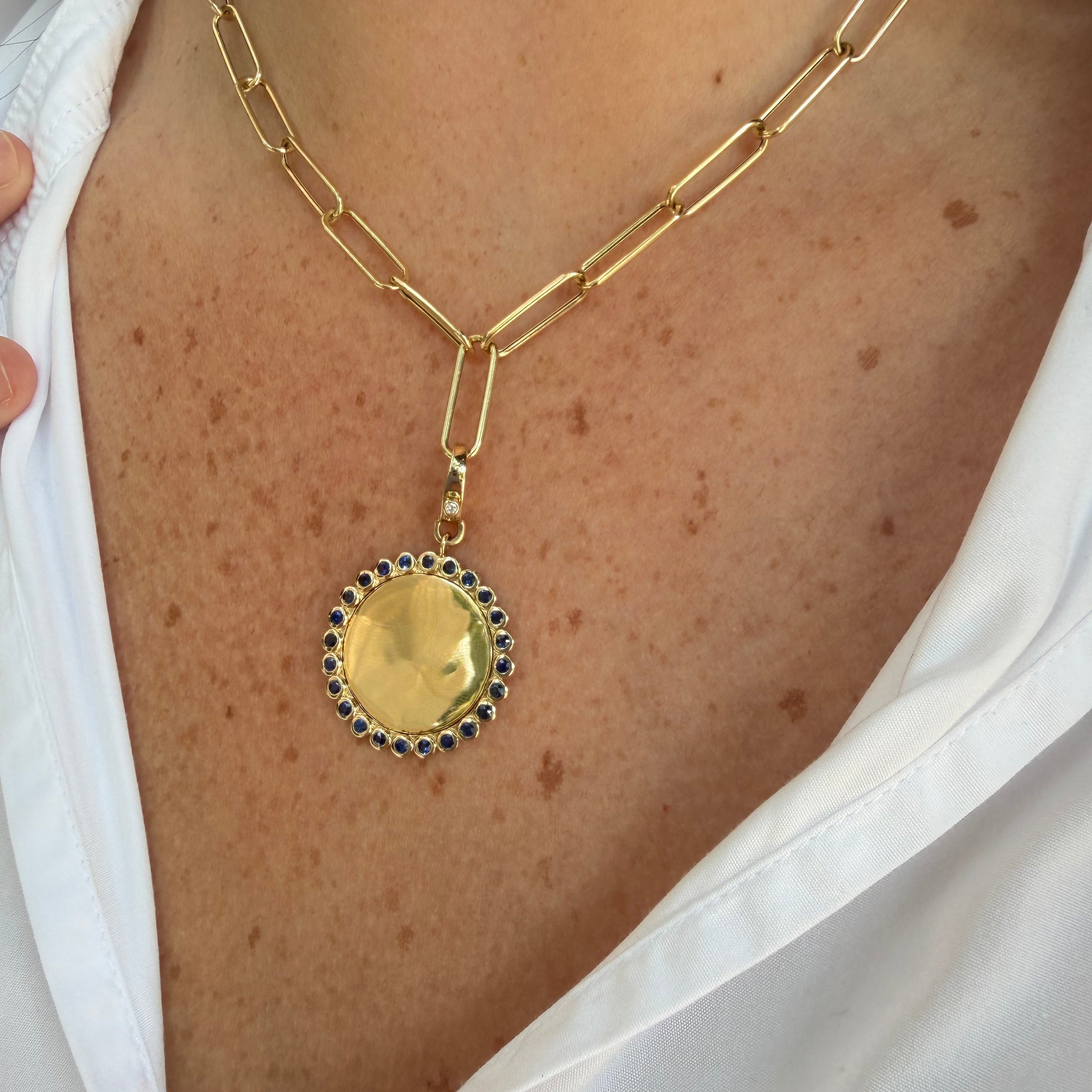 yg_sapphire_bezel_pendant_on_neck