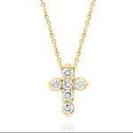 A 14K yellow gold diamond cross necklace on a white background.