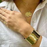 14k yellow gold wide cuff bracelet on model
