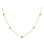 An 18K yellow gold necklace with a series of twist bezel set diamonds by the yard.