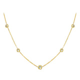 An 18K yellow gold necklace with a series of twist bezel set diamonds by the yard.