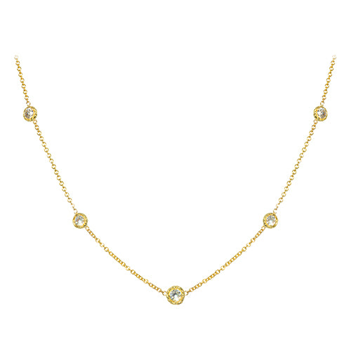 An 18K yellow gold necklace with a series of twist bezel set diamonds by the yard.