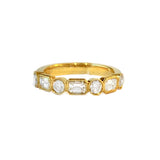 An 18K yellow gold band ring with bezel set round and baguette diamonds
