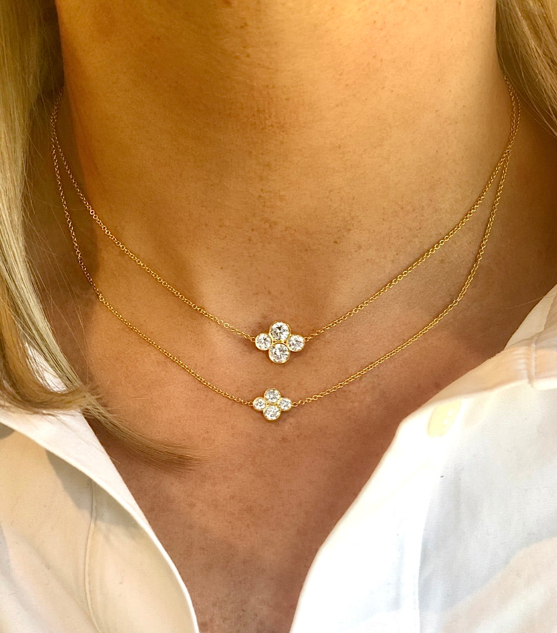 woman wearing two 18K yellow gold "Anderson" necklaces