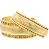 18K yellow gold cuff bracelets designed by Laura Pearce