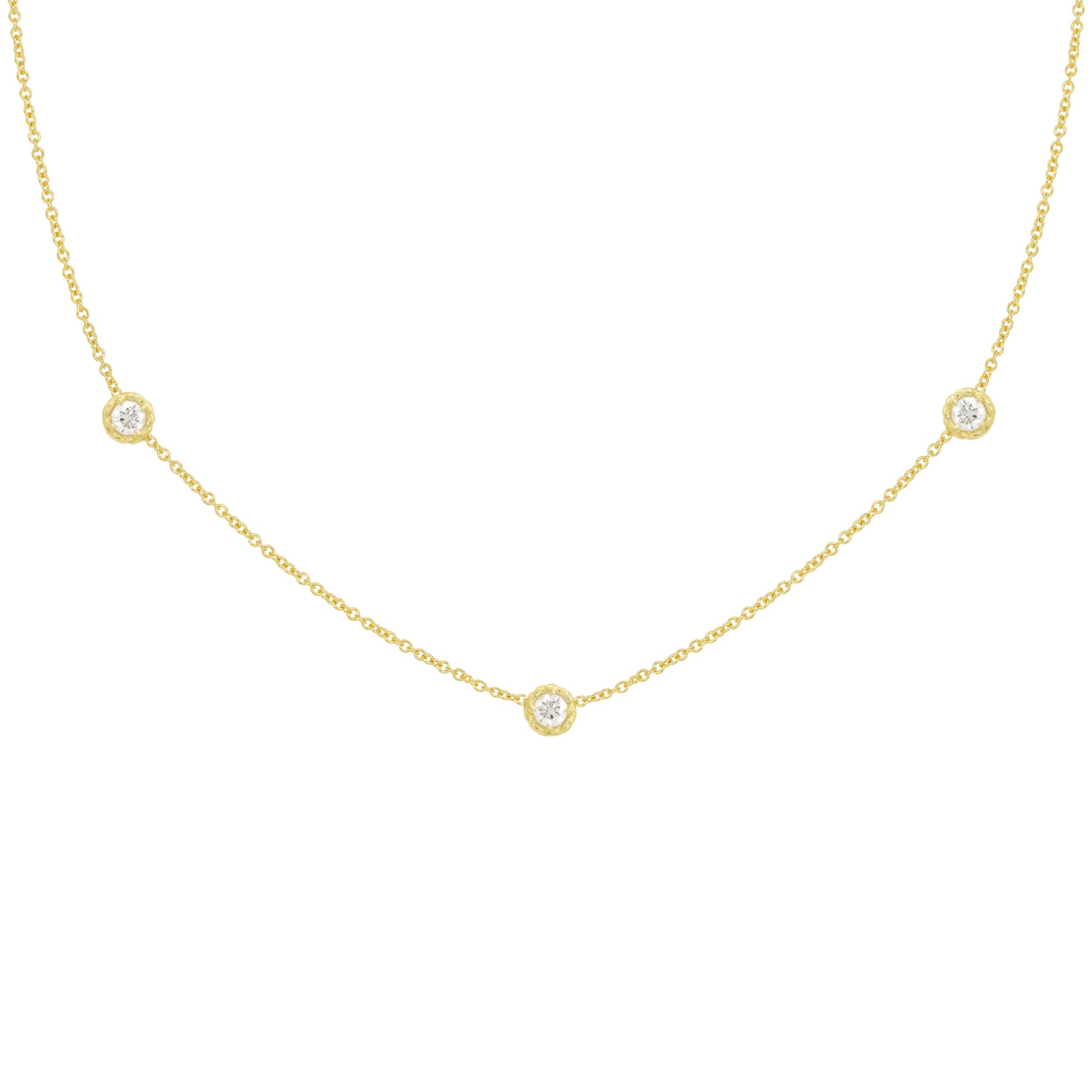 An 18k yellow gold necklace with a twist bezel diamond design featuring three diamonds by the yard.