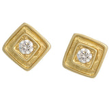 A pair of 18K yellow gold square earrings with a diamond in the center, set in a gold frame with a textured surface.
