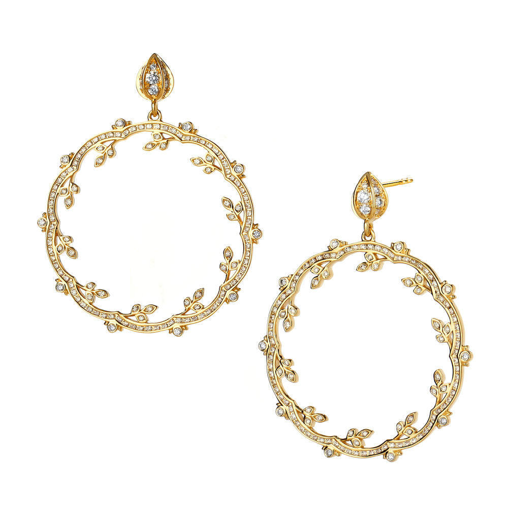 A pair of 18k yellow gold diamond drop earrings with floral patterns.