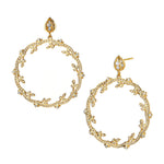 A pair of 18k yellow gold diamond drop earrings with floral patterns.