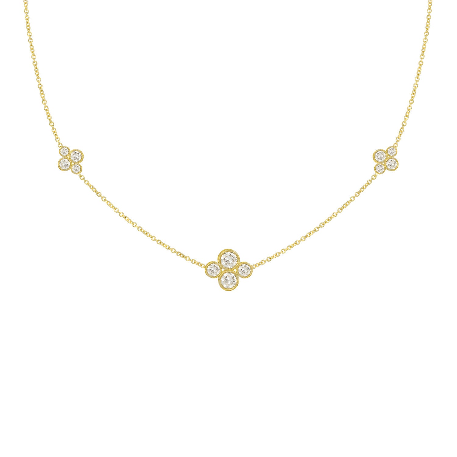 An 18k yellow gold necklace with multiple diamond stations arranged in a line on a white background.