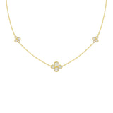 An 18k yellow gold necklace with multiple diamond stations arranged in a line on a white background.