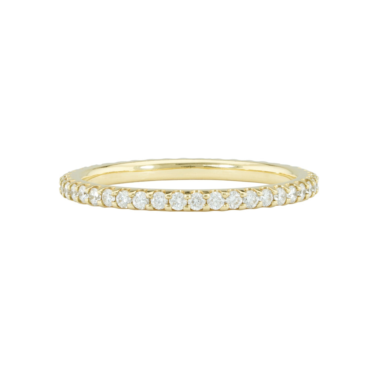 An 18k yellow gold eternity band with shared prong set diamonds