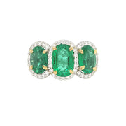 18k Two Tone 3 Stone Emerald Ring with Diamond Halo