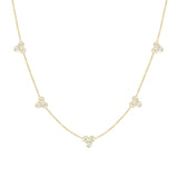 An 18k yellow gold necklace featuring five station clusters of diamonds, displayed on a white background.