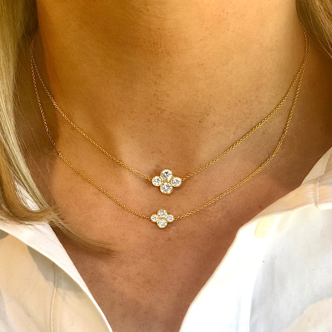 Woman wearing two Anderson diamond necklaces