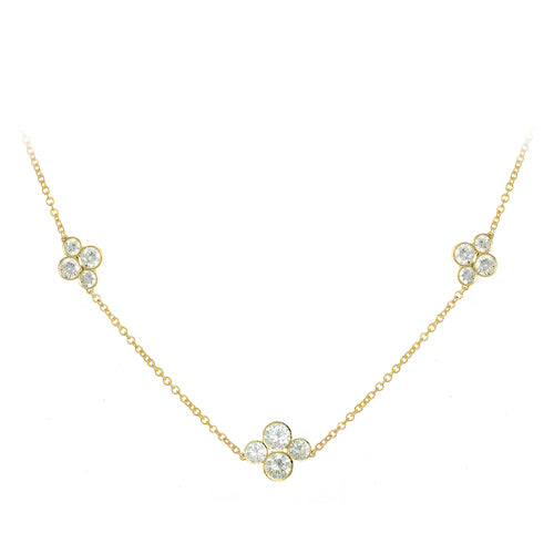An 18k yellow gold necklace featuring three diamond station clusters with round diamonds set in a floral-like design on a white background.