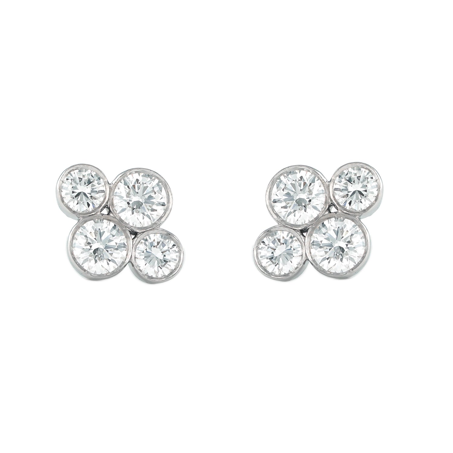 A pair of platinum diamond stud earrings designed by Laura Pearce.